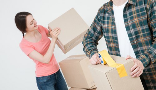 Professional furniture removals truck and movers in Putney street setting