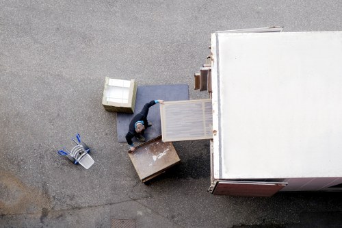 Piano movers navigating a narrow Putney staircase safely