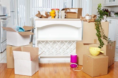 Packed moving boxes and furniture ready for a Putney removal service