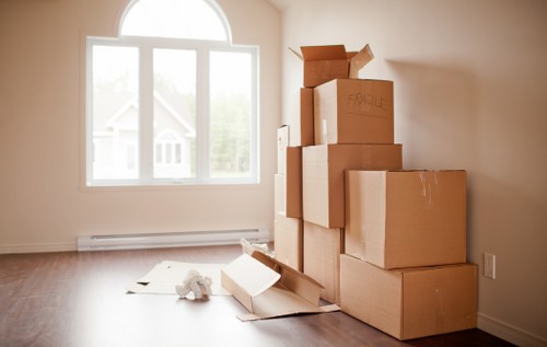 Packed boxes and furniture prepared for transport by removers