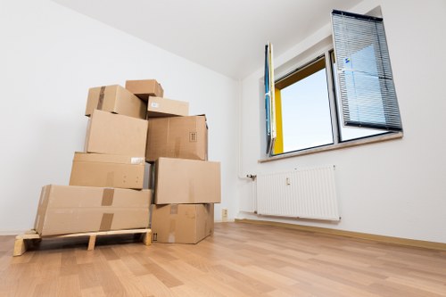 Local removal van transporting furniture through Putney streets