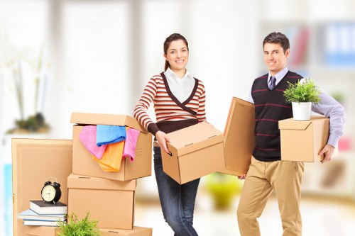 Local office moving team handling furniture and equipment in Putney