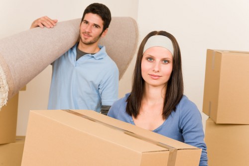 Organised moving crew handling household belongings with care