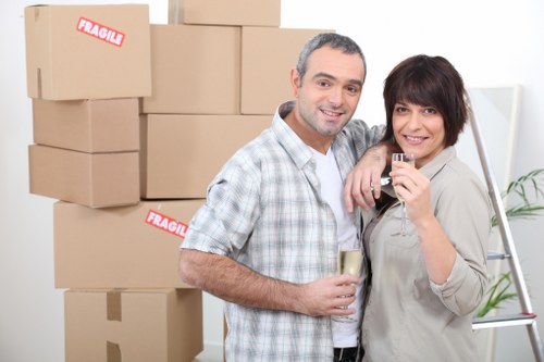 Boxes and household items arranged for cubic-yard pricing estimate